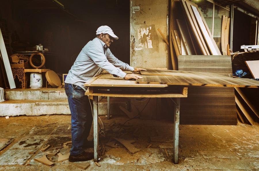 Kitchen fitter assembling a worktop on the bench