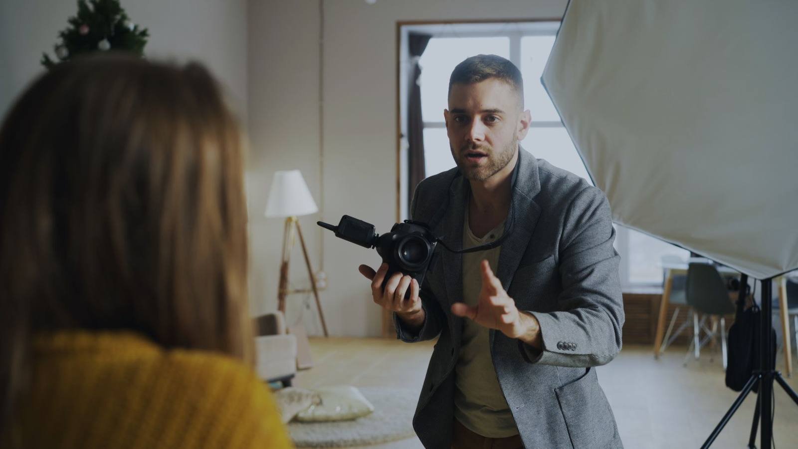 UK photographer directing a portrait shoot in a home studio