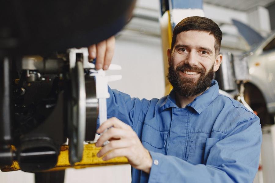 UK plumber smiling at work