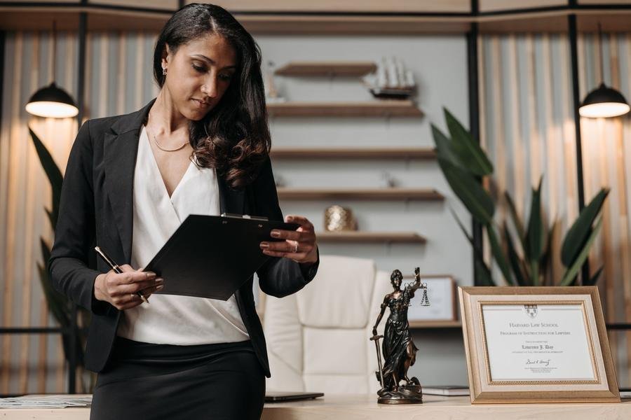 UK solicitor reviewing case documents in a law office